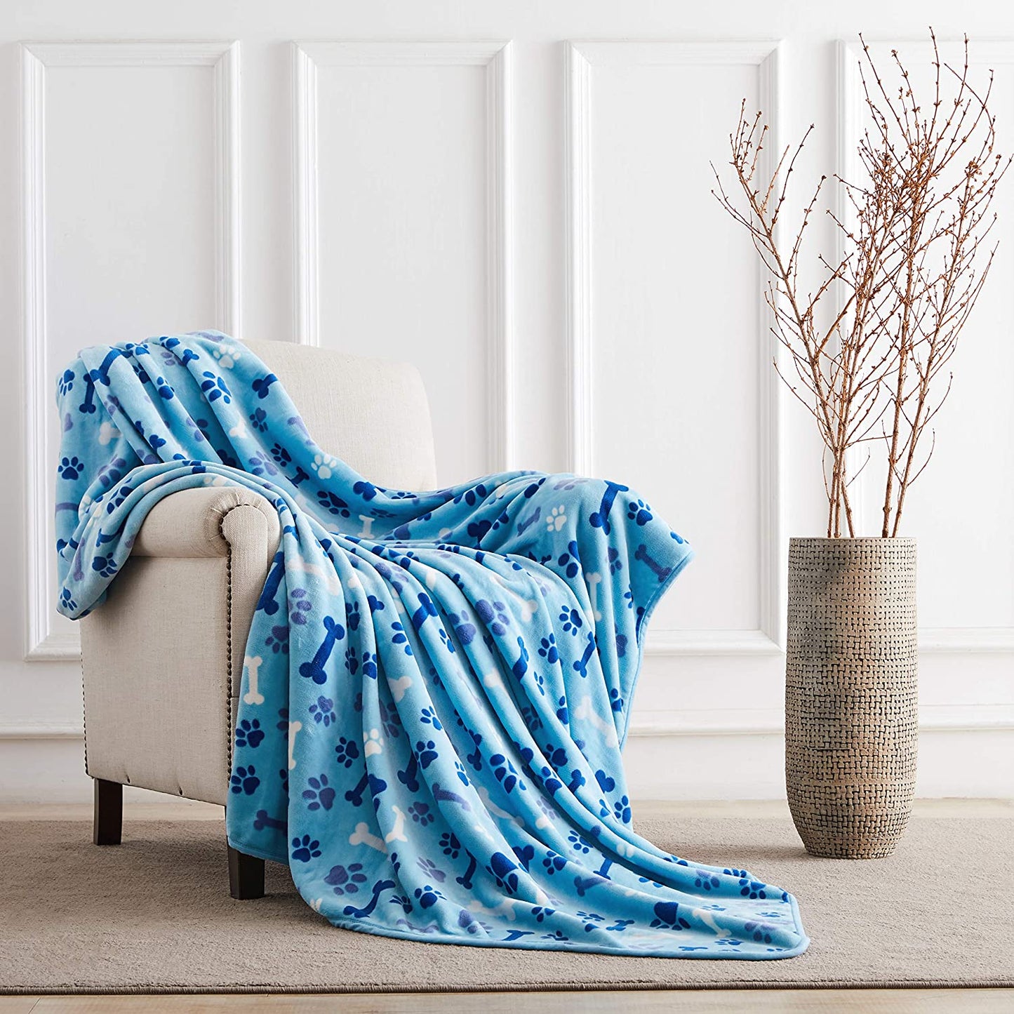 "Cozy and Stylish Blue Paw and Bone Dog Blanket - The Ultimate Luxury for Your Beloved Pet!"