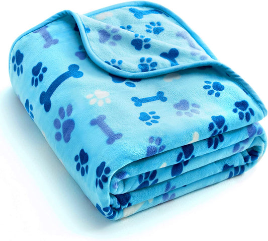 "Cozy and Stylish Blue Paw and Bone Dog Blanket - The Ultimate Luxury for Your Beloved Pet!"